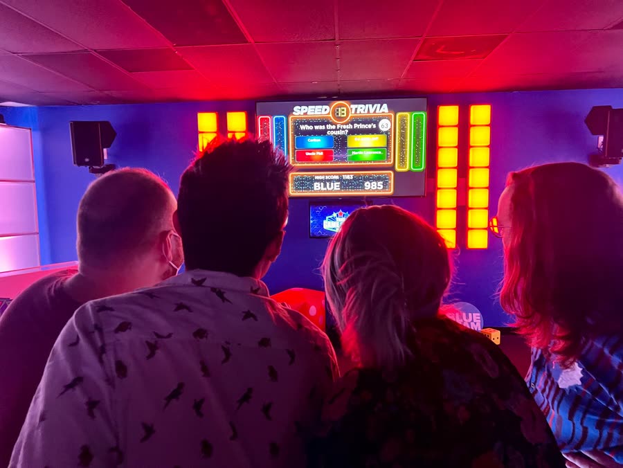 Players watching a Speed Trivia question come up on the studio screen